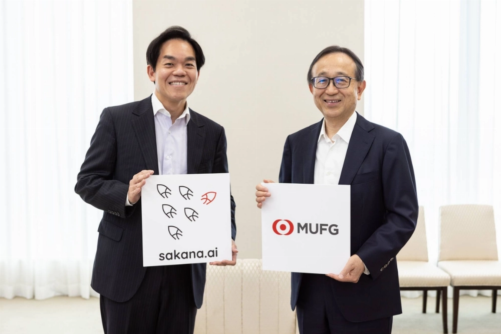 Sakana AI Chief Operating Officer Ren Ito (left) and Mitsubishi UFJ Financial Group President Hironori Kamezawa in Tokyo on Friday. The companies have entered into a ¥5 billion ($34 million) deal to automate the creation of banking documents. Sakana AI Chief Operating Officer Ren Ito (left) and Mitsubishi UFJ Financial Group President Hironori Kamezawa in Tokyo on Friday. The companies have entered into a ¥5 billion ($34 million) deal to automate the creation of banking documents.