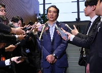 Agriculture minister Taku Eto responds to questions from reporters on Monday at the Prime Minister's Office. | Jiji