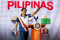 Philippine President Ferdinand Marcos Jr. waves during a campaign rally ahead of midterm elections, in Mandaluyong, Metro Manila, on May 9. | REUTERS