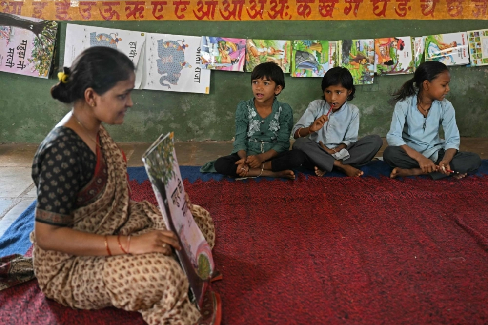 Lakshmi Kumari Patel (left) teaches students at a primary school at Nichla Fala village in India's Rajasthan state.  Lakshmi Kumari Patel (left) teaches students at a primary school at Nichla Fala village in India's Rajasthan state.