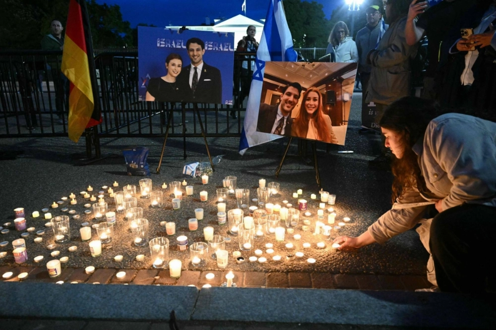 A candlelight vigil is held in Lafayette Square in Washington on Thursday following the fatal shooting of two employees of the Israeli Embassy. A candlelight vigil is held in Lafayette Square in Washington on Thursday following the fatal shooting of two employees of the Israeli Embassy.