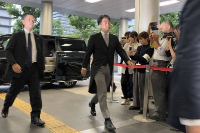 Shinjiro Koizumi, Japan's newly appointed agriculture minister, arrives at the ministry building in Tokyo on Wednesday. He replaced Taku Eto, who quit after saying he’s never needed to buy rice, a comment that angered many people. Shinjiro Koizumi, Japan's newly appointed agriculture minister, arrives at the ministry building in Tokyo on Wednesday. He replaced Taku Eto, who quit after saying he’s never needed to buy rice, a comment that angered many people.