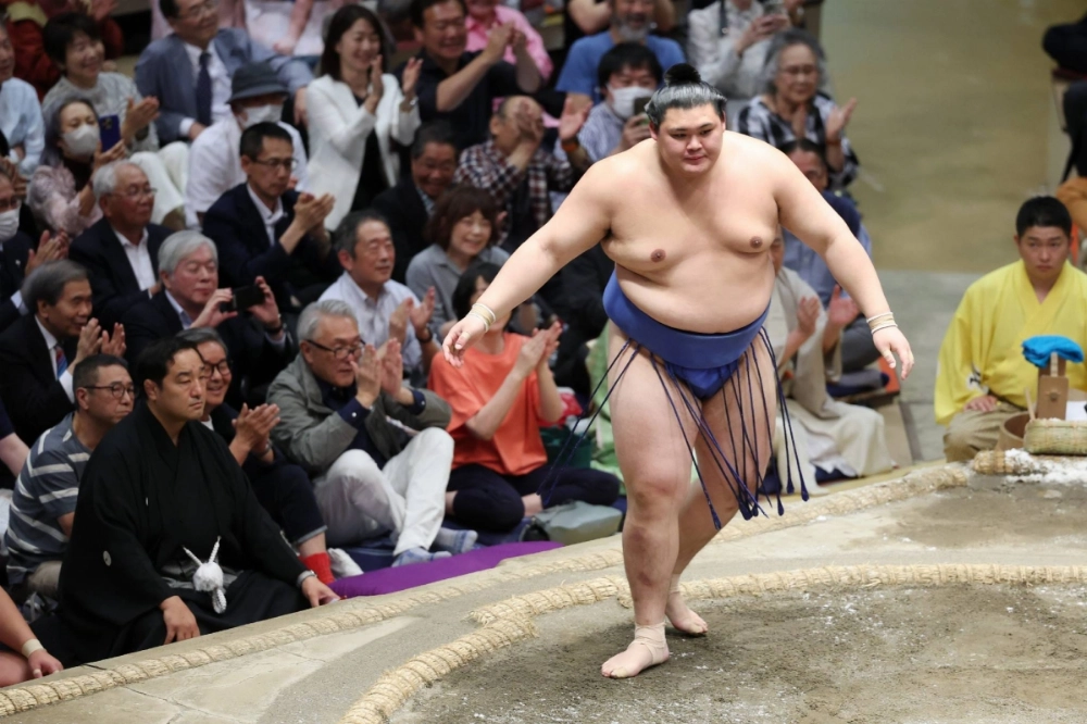 Onosato after defeating Kotozakura at Ryogoku Kokugikan in Tokyo on Friday. The win gave him a 13-0 record and clinched the Emperor's Cup, assuring him of promotion to yokozuna next week. Onosato after defeating Kotozakura at Ryogoku Kokugikan in Tokyo on Friday. The win gave him a 13-0 record and clinched the Emperor's Cup, assuring him of promotion to yokozuna next week.