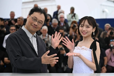 Director Koji Fukada and actor Kyoko Saito pose during a photocall for Fukada's new film, "Love on Trial," in Cannes, France.  Director Koji Fukada and actor Kyoko Saito pose during a photocall for Fukada's new film, "Love on Trial," in Cannes, France.