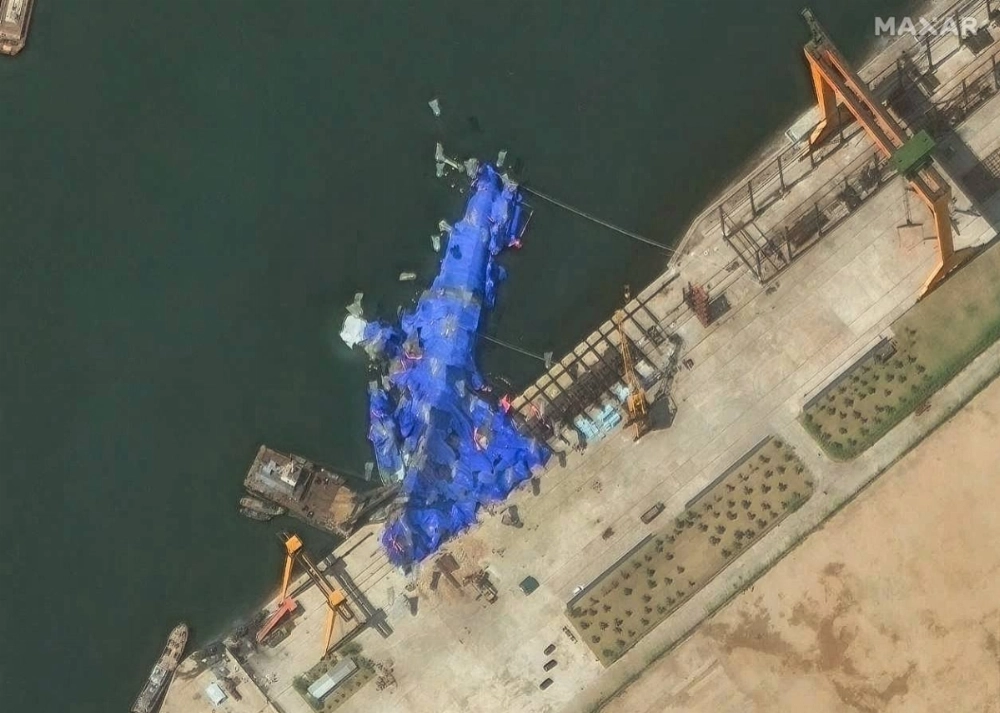 This satellite image taken Friday shows a new North Korean warship lying in the harbor after its failed launch in the port city of Chongjin. This satellite image taken Friday shows a new North Korean warship lying in the harbor after its failed launch in the port city of Chongjin.