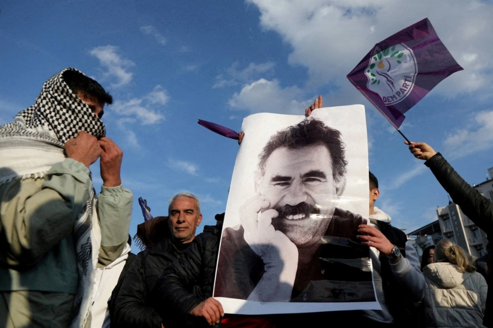 Demonstrators parade a picture of jailed Kurdish militant leader Abdullah Ocalan during a rally in Diyarbakir, Turkey, in February. The PKK’s decision to disband after decades of armed struggle marks a historic opportunity for Turkey to resolve its Kurdish issue through political reform. Demonstrators parade a picture of jailed Kurdish militant leader Abdullah Ocalan during a rally in Diyarbakir, Turkey, in February. The PKK’s decision to disband after decades of armed struggle marks a historic opportunity for Turkey to resolve its Kurdish issue through political reform.