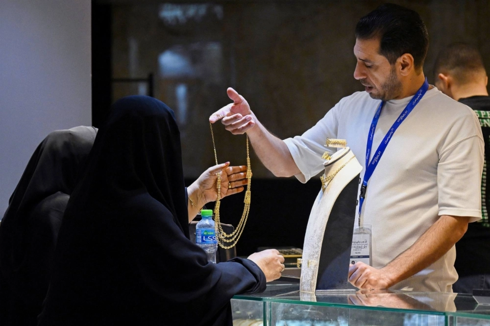 Women visit a stand during the 23rd international gold and jewellery exhibition in Kuwait City on May 21. Women visit a stand during the 23rd international gold and jewellery exhibition in Kuwait City on May 21.