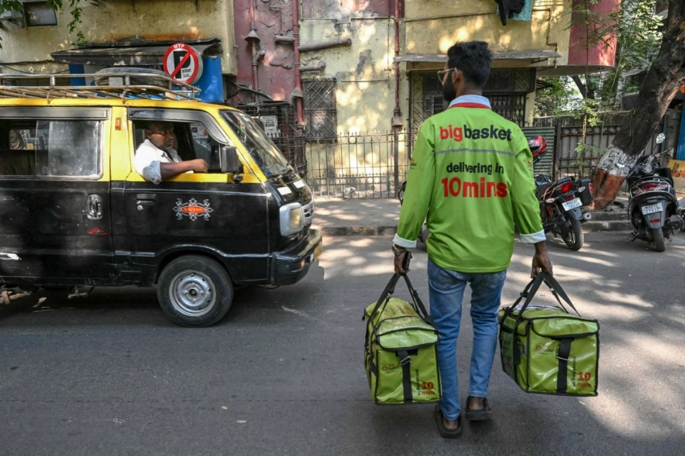 At a warehouse managed by online grocer BigBasket in central Mumbai, employees work with military-like precision to pull off deliveries in just 10 minutes.  At a warehouse managed by online grocer BigBasket in central Mumbai, employees work with military-like precision to pull off deliveries in just 10 minutes.