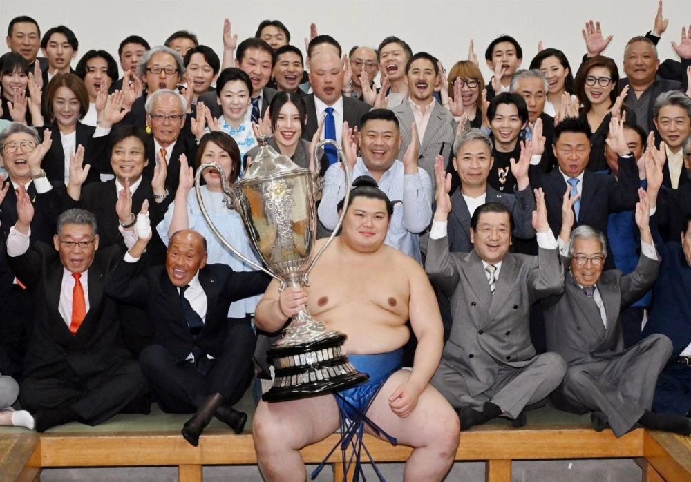 Onosato celebrates winning the Summer Grand Sumo Tournament at the Ryogoku Kokugikan in Tokyo on Sunday. Onosato celebrates winning the Summer Grand Sumo Tournament at the Ryogoku Kokugikan in Tokyo on Sunday.