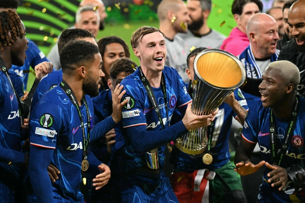 Cole Palmer holds the trophy after Chelsea's win over Real Betis in the Conference League final in Wroclaw, Poland, on Wednesday. Cole Palmer holds the trophy after Chelsea's win over Real Betis in the Conference League final in Wroclaw, Poland, on Wednesday.