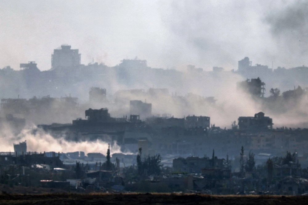 Smoke billows in the Gaza Strip on Thursday. Smoke billows in the Gaza Strip on Thursday.