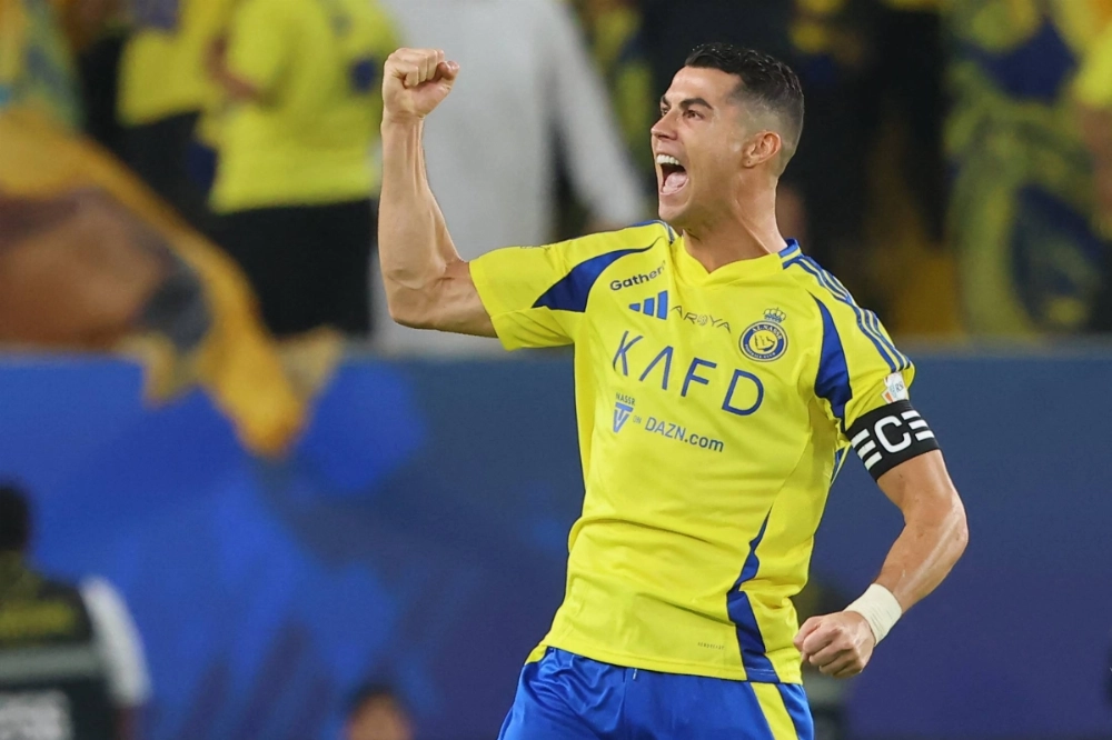 Cristiano Ronaldo celebrates after scoring for Al Nassr during a Saudi Pro League match against Al-Qadsiah in Riyadh on Nov. 22, 2024. Cristiano Ronaldo celebrates after scoring for Al Nassr during a Saudi Pro League match against Al-Qadsiah in Riyadh on Nov. 22, 2024.