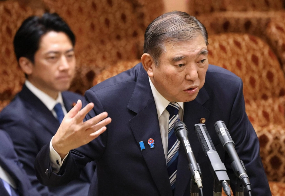 Prime Minister Shigeru Ishiba speaks at an Upper House Budget Committee meeting on Monday as agriculture minister Shinjiro Koizumi looks on. Prime Minister Shigeru Ishiba speaks at an Upper House Budget Committee meeting on Monday as agriculture minister Shinjiro Koizumi looks on.