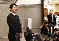 Hyogo Gov. Motohiko Saito speaks to the press following the opening of the prefectural assembly's June regular session on Tuesday. | Jiji