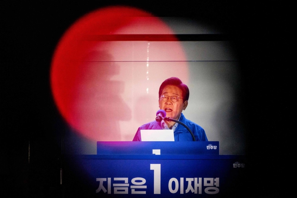 Lee Jae-myung, the Democratic Party's  candidate in South Korea's presidential election, speaks during his final campaign event in Seoul on Monday night ahead of Tuesday's vote. Lee Jae-myung, the Democratic Party's  candidate in South Korea's presidential election, speaks during his final campaign event in Seoul on Monday night ahead of Tuesday's vote.
