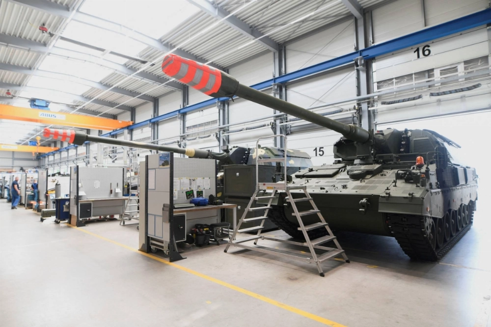 Self-propelled guns are refurbished at a Rheinmetall plant in Unterluess, Germany, in June 2023.   Self-propelled guns are refurbished at a Rheinmetall plant in Unterluess, Germany, in June 2023.