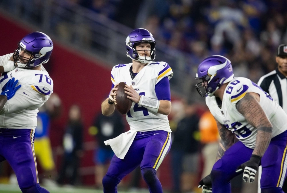 Vikings quarterback Sam Darnold (center) during the NFC wild card game against the Los Angeles Rams at State Farm Stadium on Jan 13, 2025. Vikings quarterback Sam Darnold (center) during the NFC wild card game against the Los Angeles Rams at State Farm Stadium on Jan 13, 2025.