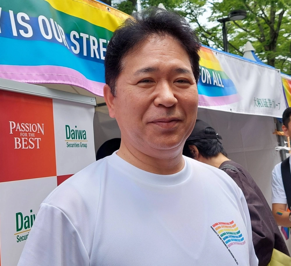 Akihiko Ogino, president and CEO of Daiwa Securities Group, says Japan should press ahead with diversity initiatives as he attends the Tokyo Pride parade in the capital's Shibuya area on Sunday. Akihiko Ogino, president and CEO of Daiwa Securities Group, says Japan should press ahead with diversity initiatives as he attends the Tokyo Pride parade in the capital's Shibuya area on Sunday.
