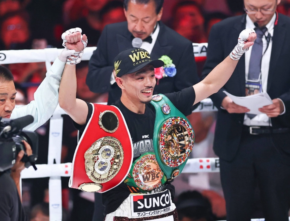 Junto Nakatani celebrates after defeating Ryosuke Nishida to unify the WBC and IBF bantamweight titles at Ariake Coliseum on Sunday. Junto Nakatani celebrates after defeating Ryosuke Nishida to unify the WBC and IBF bantamweight titles at Ariake Coliseum on Sunday.