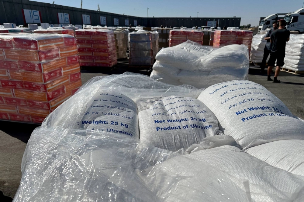 Supplies wait to be loaded on trucks to go into the Gaza Strip, at the Kerem Shalom crossing between Israel and Gaza, on its Israeli side, on May 29. Supplies wait to be loaded on trucks to go into the Gaza Strip, at the Kerem Shalom crossing between Israel and Gaza, on its Israeli side, on May 29.