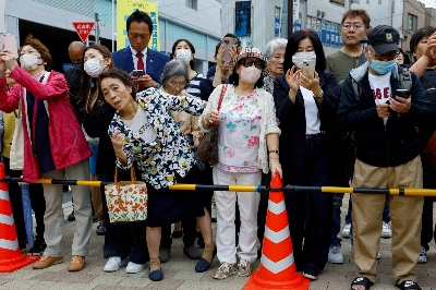 Voters in Tokyo listen to a speech by a candidate in Japan's Oct. 27, 2024 general election. Voters in Tokyo listen to a speech by a candidate in Japan's Oct. 27, 2024 general election.