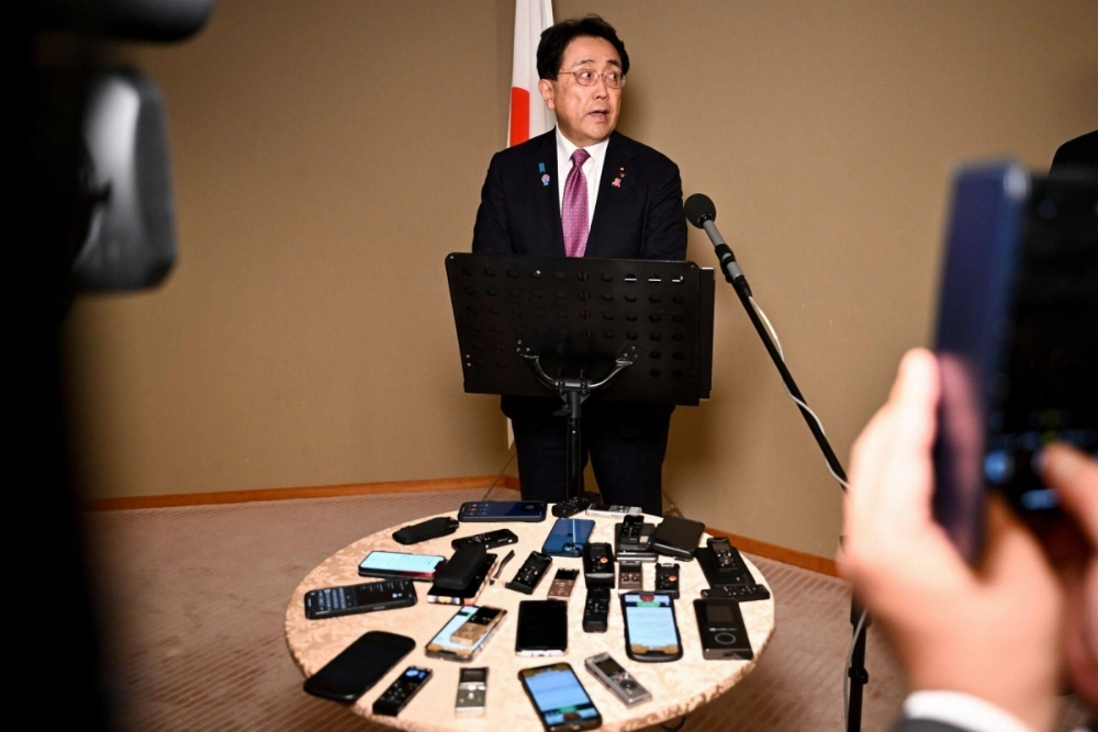 Ryosei Akazawa, Japan's economic revitalization minster, speaks to members of the media in Washington on Friday. Ryosei Akazawa, Japan's economic revitalization minster, speaks to members of the media in Washington on Friday.