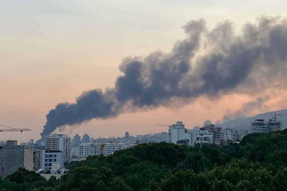 Smoke billows from an explosion at the Islamic Republic of Iran Broadcasting (IRIB) building in Tehran on Monday after it was struck in an Israeli attack. Smoke billows from an explosion at the Islamic Republic of Iran Broadcasting (IRIB) building in Tehran on Monday after it was struck in an Israeli attack.