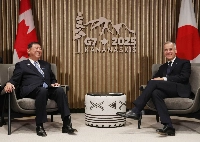Prime Minister Shigeru Ishiba (left) and his Canadian counterpart, Mark Carney, hold talks on Monday in Kananaskis, Canada. | Pool / via Jiji