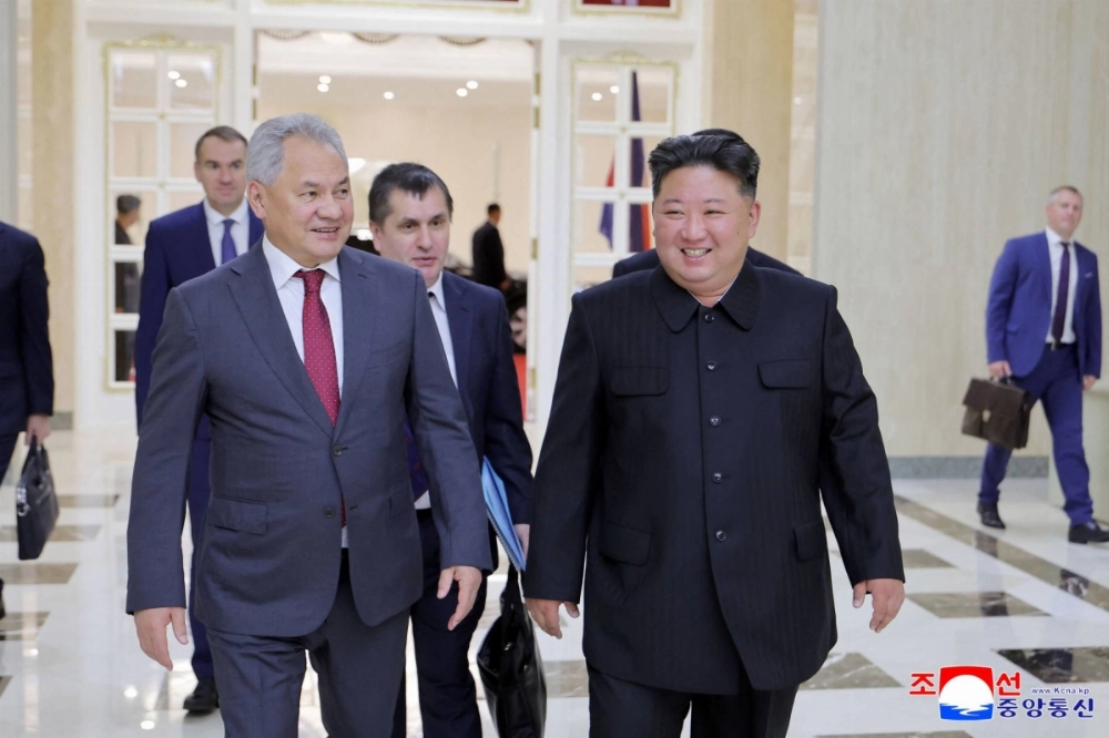 North Korean leader Kim Jong Un (right) meets with Russian Security Council Secretary Sergei Shoigu (left) at the headquarters of the Central Committee of the Workers' Party of Korea in Pyongyang on Tuesday.  North Korean leader Kim Jong Un (right) meets with Russian Security Council Secretary Sergei Shoigu (left) at the headquarters of the Central Committee of the Workers' Party of Korea in Pyongyang on Tuesday.