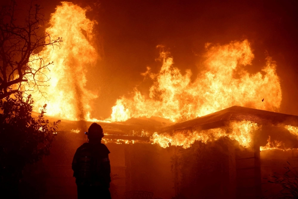 A firefighter works during the Eaton Fire in Pasadena, California, on Jan. 8. A firefighter works during the Eaton Fire in Pasadena, California, on Jan. 8.