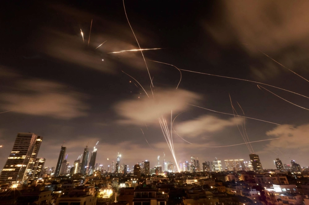 Israeli air defense systems intercept Iranian missiles over the Israeli city of Tel Aviv early on Wednesday. Israeli air defense systems intercept Iranian missiles over the Israeli city of Tel Aviv early on Wednesday.