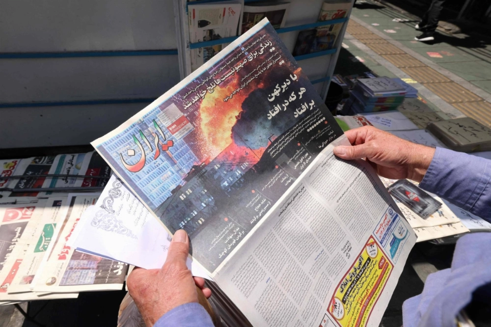 An Iranian daily newspaper displays an image of a damaged building in Israel on Sunday. Israel’s attack on Iran’s nuclear program has raised tensions, exposed divisions and put pressure on the U.S. to decide on its next move. An Iranian daily newspaper displays an image of a damaged building in Israel on Sunday. Israel’s attack on Iran’s nuclear program has raised tensions, exposed divisions and put pressure on the U.S. to decide on its next move.