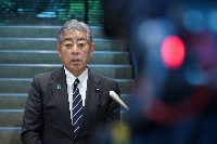 Foreign Minister Takeshi Iwaya speaks to reporters at the Foreign Ministry on Friday. | AFP-JIJI
