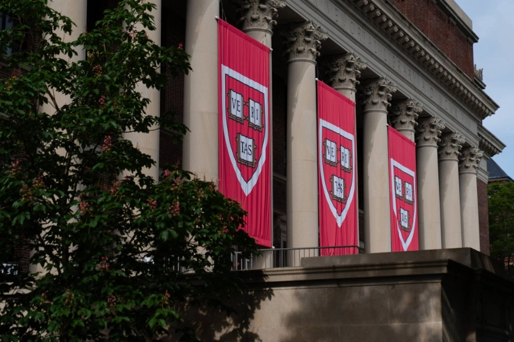 Harvard University’s crest is displayed on banners from the Harry Elkins Widener Memorial Library on campus in Cambridge, Massachusetts, last month.  Harvard University’s crest is displayed on banners from the Harry Elkins Widener Memorial Library on campus in Cambridge, Massachusetts, last month.