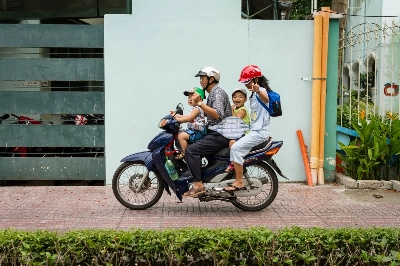 A family travels by motorbike in Ho Chi Minh City. Vietnam is grappling with two significant challenges: a declining birth rate, prompting policy shifts to encourage larger families, and the economic threat of U.S. tariffs. A family travels by motorbike in Ho Chi Minh City. Vietnam is grappling with two significant challenges: a declining birth rate, prompting policy shifts to encourage larger families, and the economic threat of U.S. tariffs.