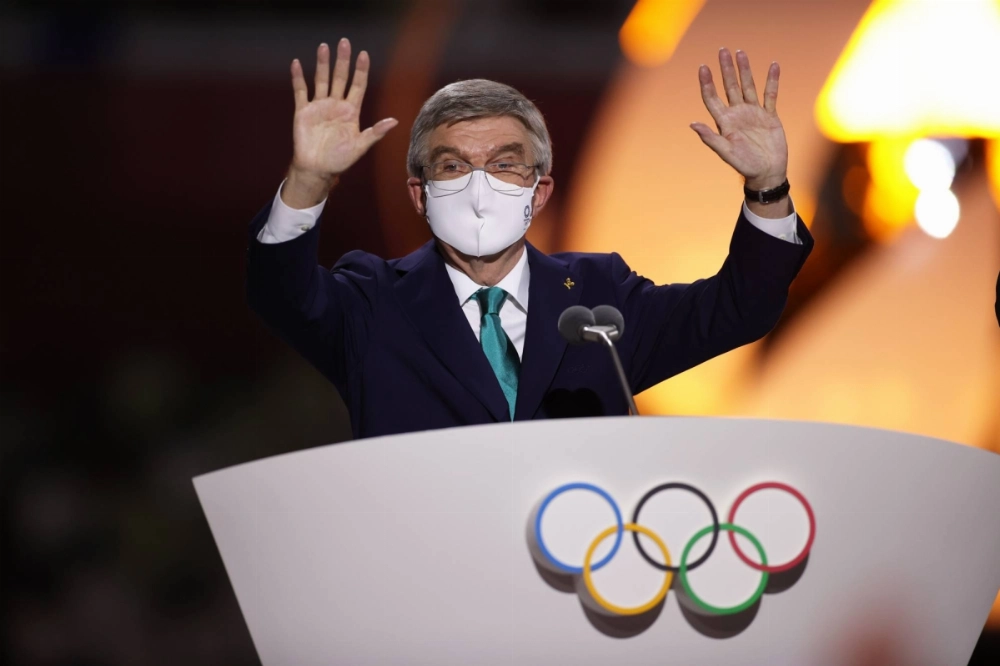 International Olympic Committee President Thomas Bach waves to the crowd during the closing ceremony of the Tokyo Games in August 2021.  International Olympic Committee President Thomas Bach waves to the crowd during the closing ceremony of the Tokyo Games in August 2021.