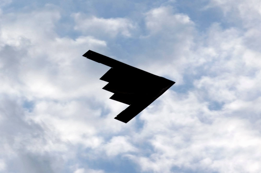 A B-2 stealth bomber flies over the Washington Monument at the National Mall, during Independence Day celebrations in Washington on July 4, 2020.  A B-2 stealth bomber flies over the Washington Monument at the National Mall, during Independence Day celebrations in Washington on July 4, 2020.