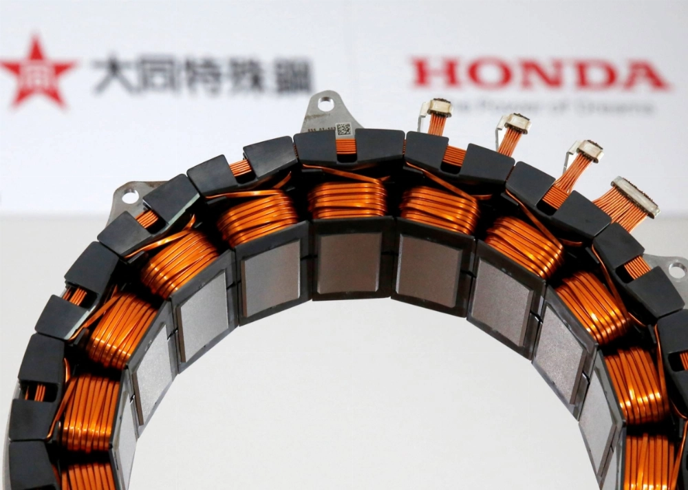 An electric motor, jointly developed by Honda and Daido Steel, for hybrid cars that uses no heavy rare earth metals  is displayed at an unveiling in Tokyo in July 2016. An electric motor, jointly developed by Honda and Daido Steel, for hybrid cars that uses no heavy rare earth metals  is displayed at an unveiling in Tokyo in July 2016.