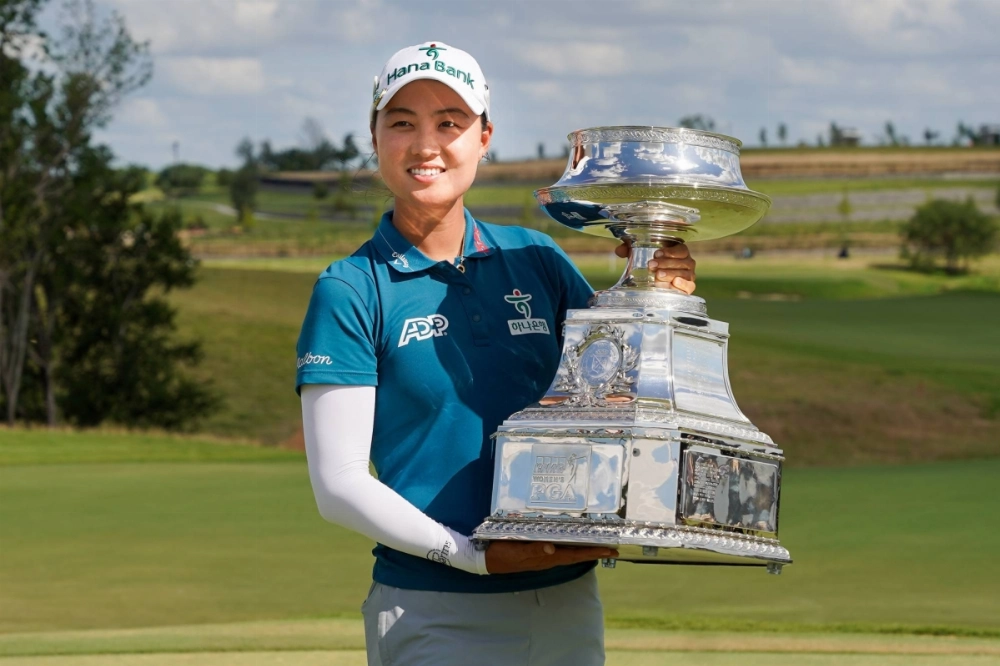 Minjee Lee poses with the winner's trophy after the final round of the Women's PGA Championship in Frisco, Texas, on Sunday. Minjee Lee poses with the winner's trophy after the final round of the Women's PGA Championship in Frisco, Texas, on Sunday.