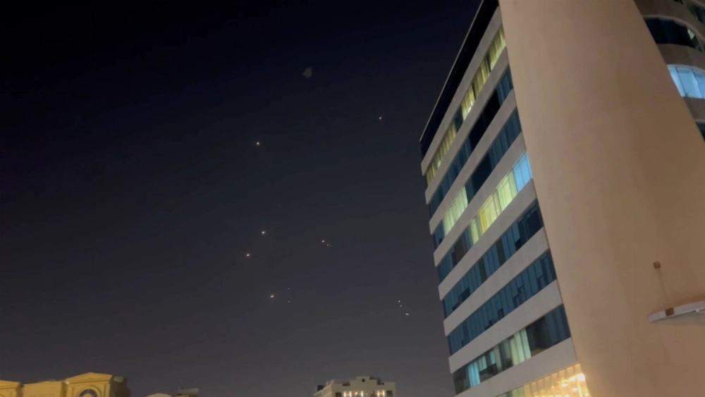 In this frame-grab taken from video, missiles and air-defense interceptors are visible over Doha after Iran launched an attack on U.S. forces at Al Udeid Air Base on Monday. In this frame-grab taken from video, missiles and air-defense interceptors are visible over Doha after Iran launched an attack on U.S. forces at Al Udeid Air Base on Monday.