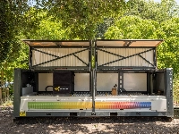 Equipped with a camera and a robotic arm, BeeHomes are able to regularly snap images of the frames inside. | Bloomberg