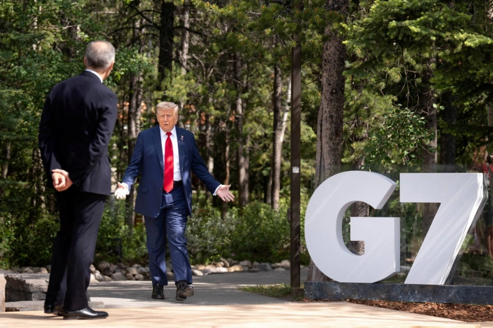 U.S. President Donald Trump is greeted by Canadian Prime Minister Mark Carney as he arrives at the Group of Seven leaders' summit in Kananaskis, Alberta, on June 16. U.S. President Donald Trump is greeted by Canadian Prime Minister Mark Carney as he arrives at the Group of Seven leaders' summit in Kananaskis, Alberta, on June 16.