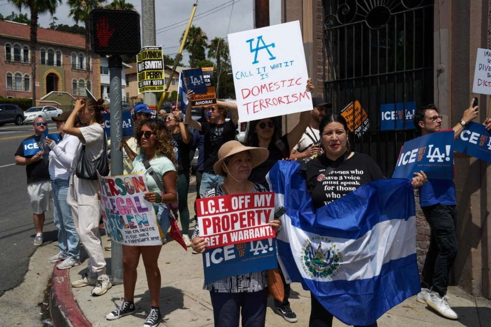 People demonstrate against Immigration and Customs Enforcement immigration raids and the Los Angeles Dodgers for not offering more support, in Los Angeles on June 21. People demonstrate against Immigration and Customs Enforcement immigration raids and the Los Angeles Dodgers for not offering more support, in Los Angeles on June 21.