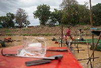 A vendor sells ice to passing fishermen during the dry season on Cambodia's Tonle Sap Lake. Experts are warning that booming sales of air conditioners could exacerbate inequality and leave the country's laborers to struggle in a warming world. | ANTON L. Delgado