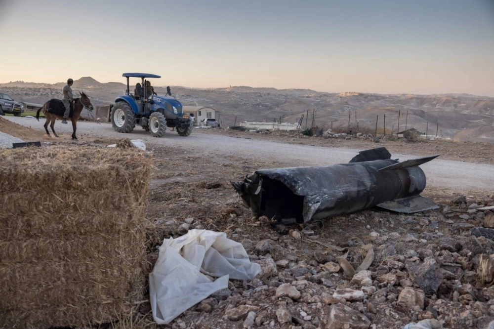 The remains of an Iranian missile launched during the 12-day Israel-Iran war lie on a road near Tekoa in the occupied West Bank on Sunday. The remains of an Iranian missile launched during the 12-day Israel-Iran war lie on a road near Tekoa in the occupied West Bank on Sunday.