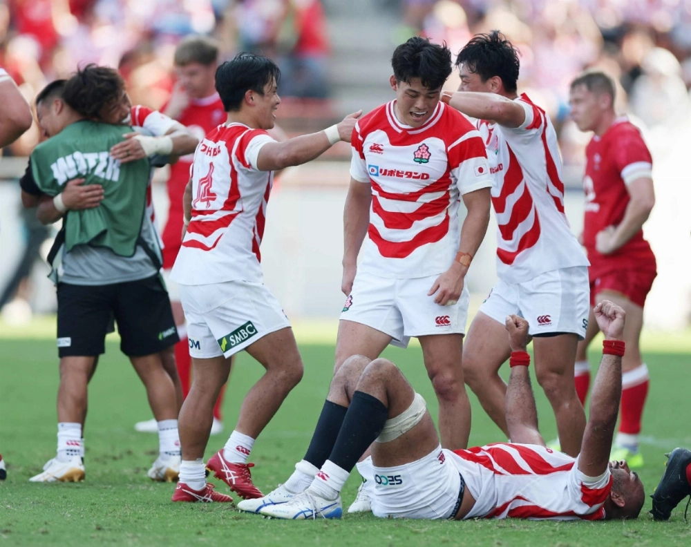 Brave Blossoms players celebrate after Japan beat Wales on Saturday in Kitakyushu.  Brave Blossoms players celebrate after Japan beat Wales on Saturday in Kitakyushu.