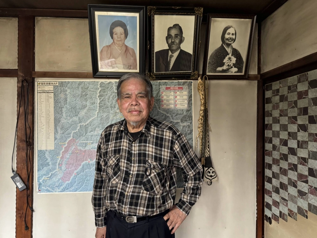 Ainu activist Fumio Kimura stands in front of photos of his ancestors at his home in Biratori, Hokkaido, in April. Ainu activist Fumio Kimura stands in front of photos of his ancestors at his home in Biratori, Hokkaido, in April.