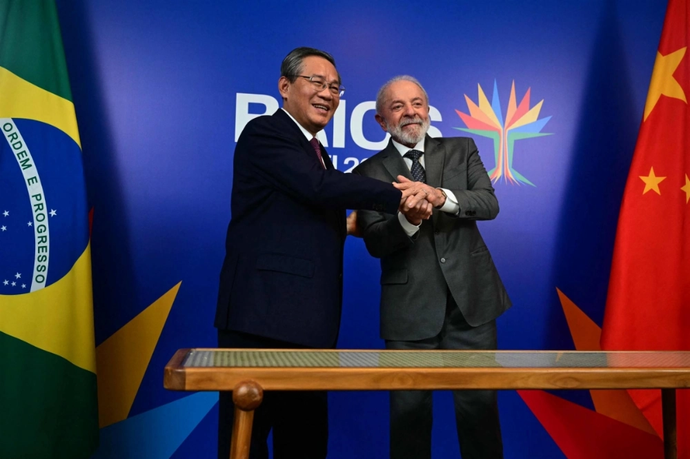 Brazilian President Luiz Inacio Lula da Silva and Chinese Premier Li Qiang pose for a picture after a bilateral meeting Saturday ahead of the BRICS summit in Rio de Janeiro on July 5.  Brazilian President Luiz Inacio Lula da Silva and Chinese Premier Li Qiang pose for a picture after a bilateral meeting Saturday ahead of the BRICS summit in Rio de Janeiro on July 5.