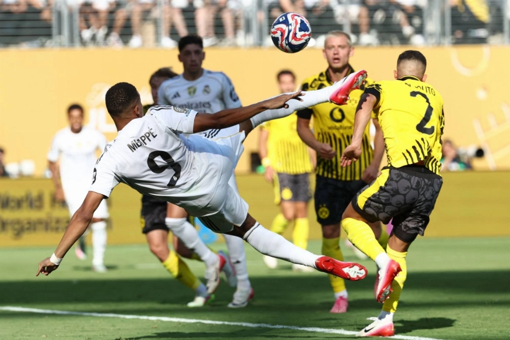 Real Madrid's Kylian Mbappe scores his team's third goal during its win over Borussia Dortmund at the Club World Cup on Saturday in East Rutherford, New Jersey. Real Madrid's Kylian Mbappe scores his team's third goal during its win over Borussia Dortmund at the Club World Cup on Saturday in East Rutherford, New Jersey.