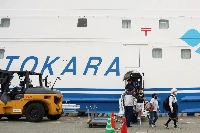 Evacuees from Akuseki Island, in the Tokara chain, which has been hit by swarms of earthquakes in recent days, arrive at Kagoshima Port on Friday afternoon. | JIJI